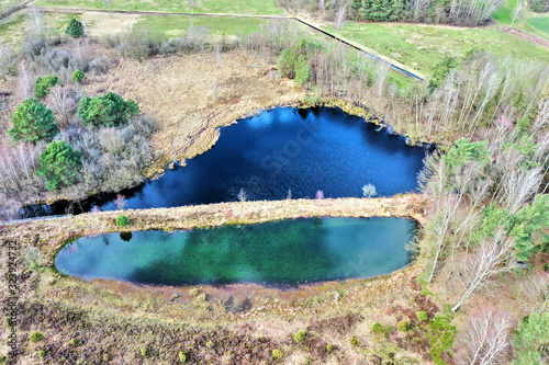 Aerial view of a lake in the German heath landscape, taken from a great height photo