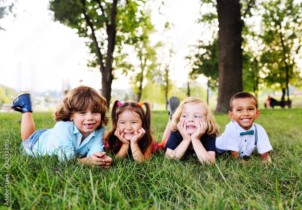 group of preschool children playing in the Park on the grass group of preschool children playing in the Park on the grass
