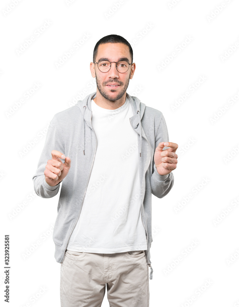 Friendly young man doing a gesture of admiration Friendly young man doing a gesture of admiration