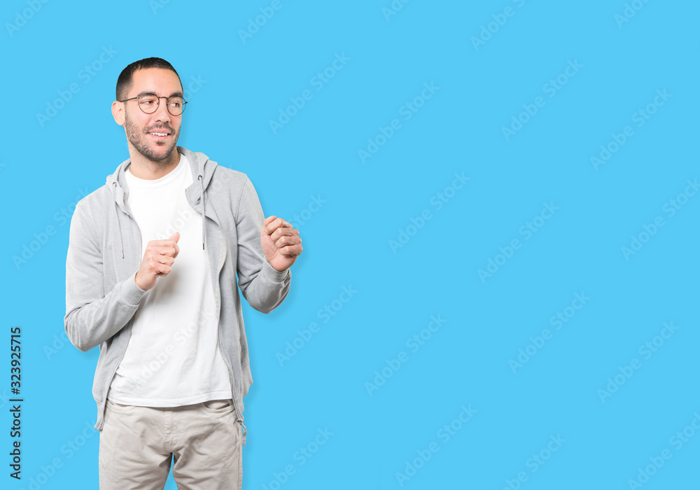 Friendly young man doing a gesture of admiration Friendly young man doing a gesture of admiration