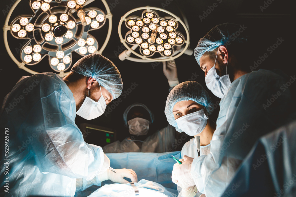 The senior surgeon in the operating room, where the patient is waiting