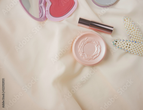 Top view,flat lay cosmetics and accessories including blush on,powder and lipstick with copy space Beauty,women concept 