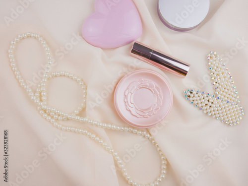 Top view,flat lay cosmetics and accessories including blush on,powder and lipstick with copy space Beauty,women concept 