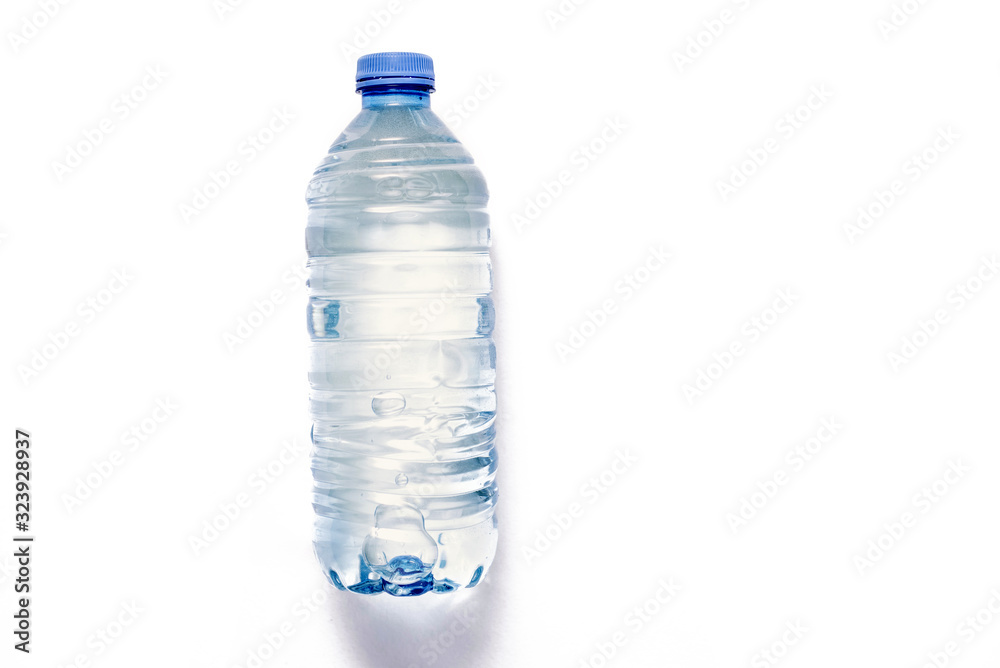 plastic bottle with a sparkle of water on a white background. Copyspace, place for text plastic bottle with a sparkle of water on a white background. Copyspace, place for text