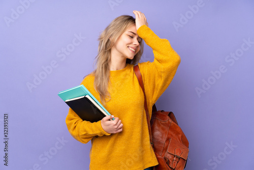 Teenager Russian student girl isolated on purple background has realized something and intending the solution