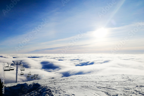 View of the clouds from the top of the ski resort. © Николай Крапивин