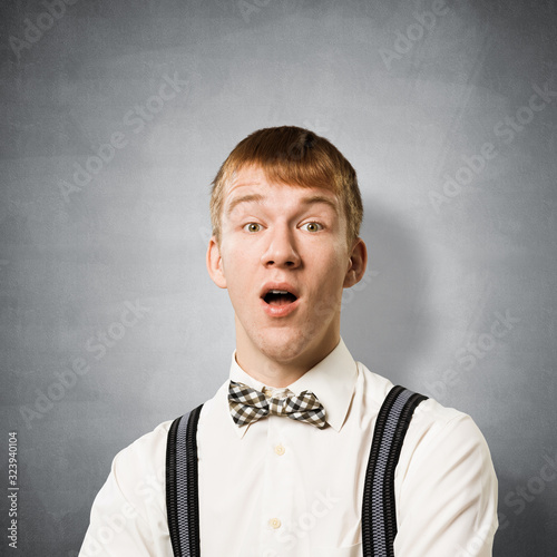 Stupefied teenager with mouth opened photo