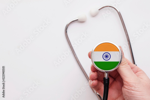 India healthcare concept. Doctor holding a medical stethoscope.