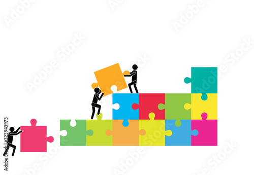 Business people pushing and assembling  jigsaw puzzle.Kooperation. Collaboration.