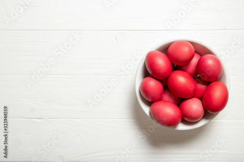 Red easter eggs in a plate. Beautiful easter eggs. Red easter eggs. Place for text