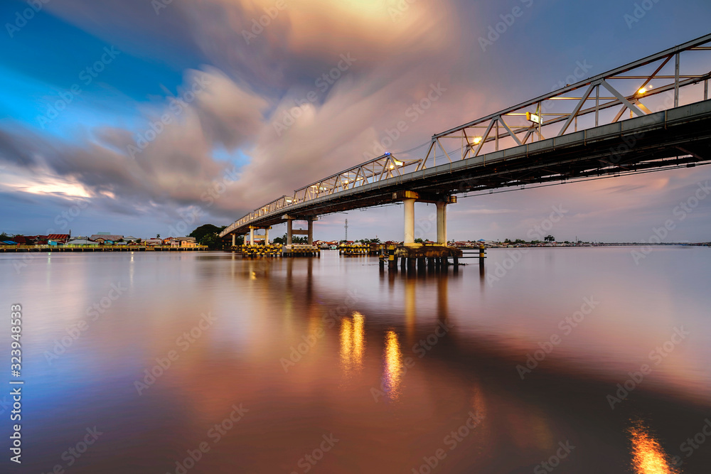bridge over river at sunset in pontianak indonesia bridge over river at sunset in pontianak indonesia