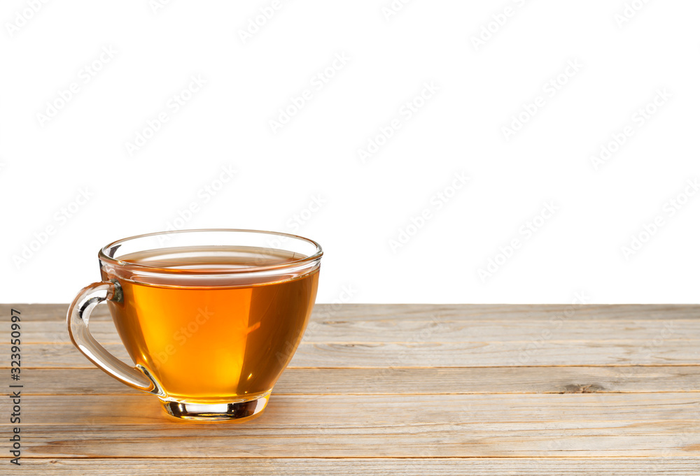 Yellow tea or herbs placed on a wooden table White background