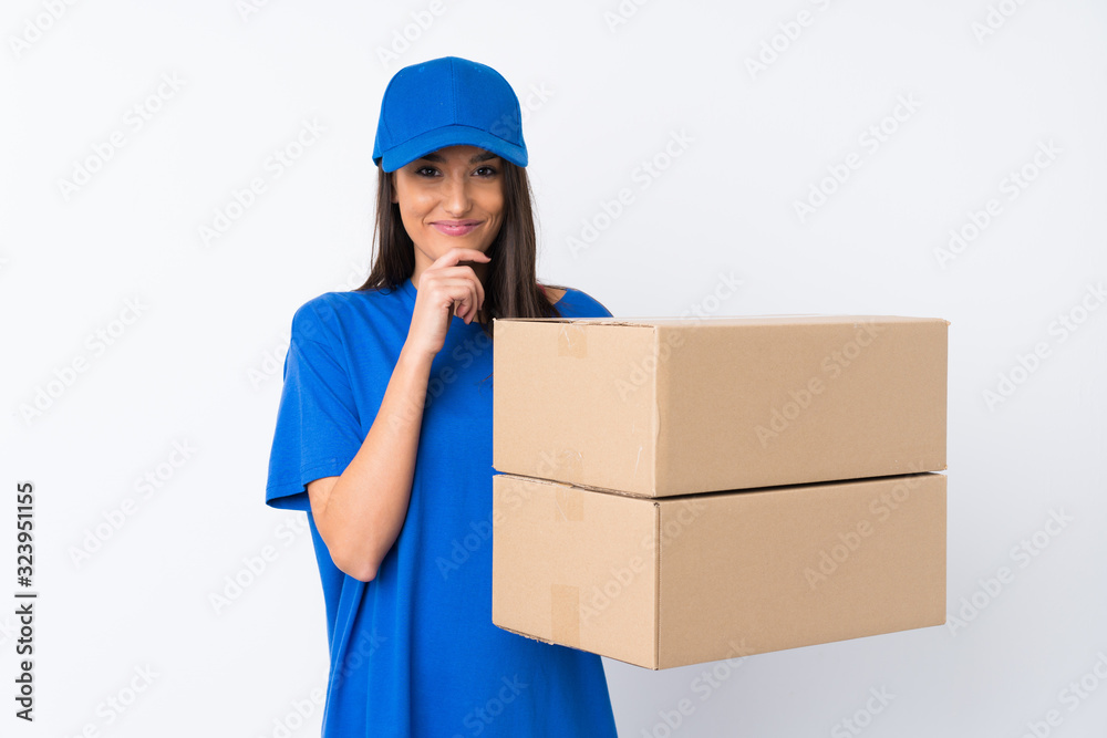 Young delivery woman over isolated white background laughing Young delivery woman over isolated white background laughing