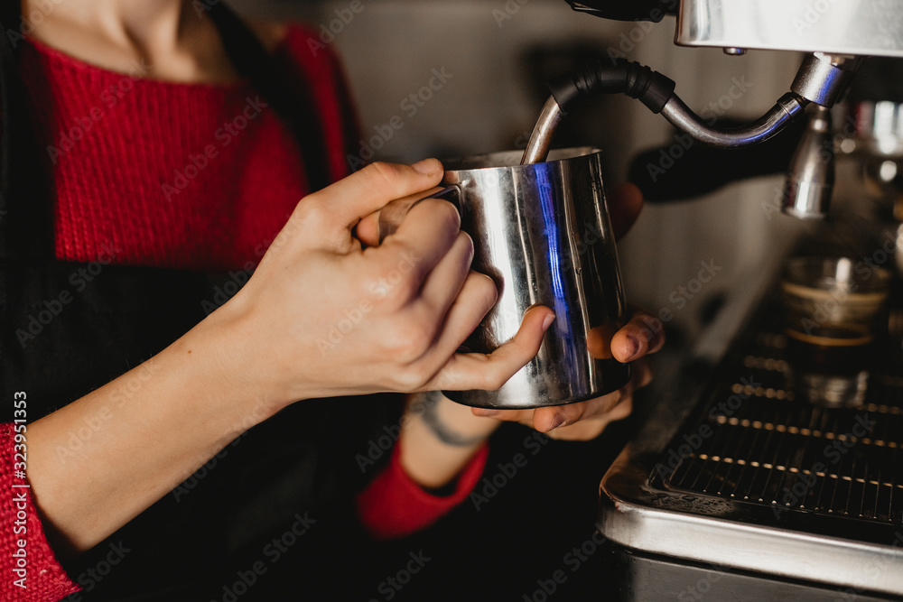 short-haired barista girl making coffee