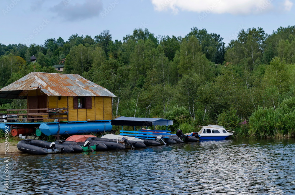 Landscape with mountain meadows, forest, house and small wharf  near artificial Vlasina mountain lake, South-eastern Serbia, Europe 