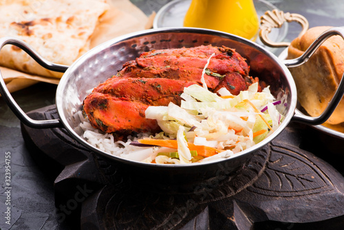 Close-up of a plate of chopped tandoori chicken