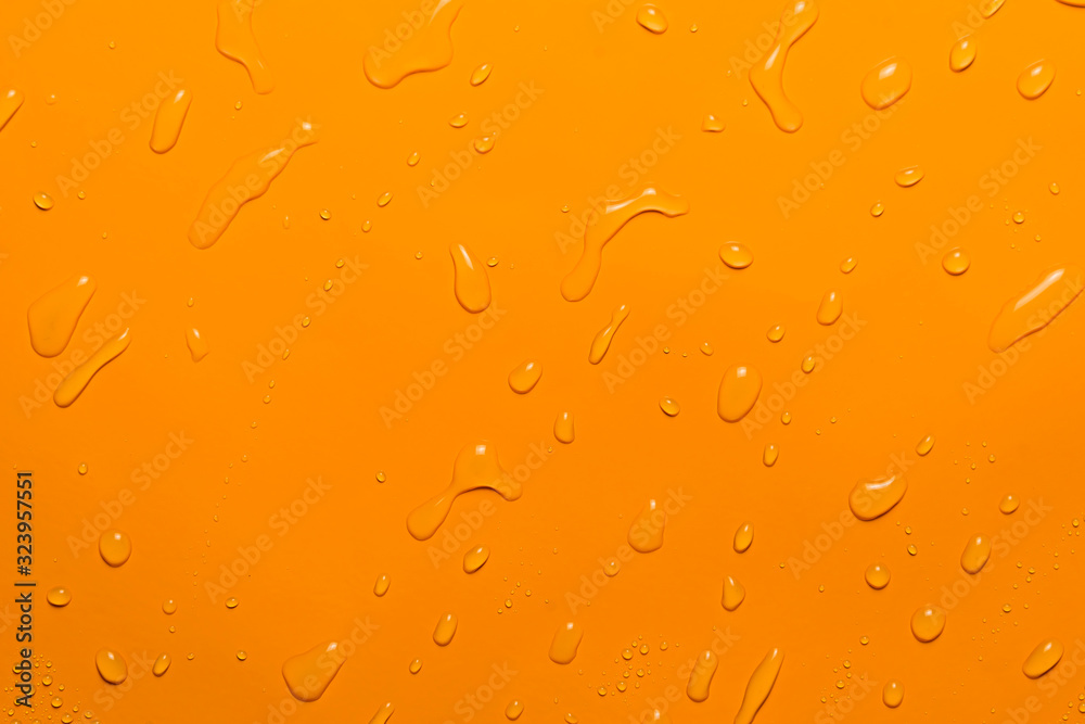 close-up water drop orange background close-up water drop orange background