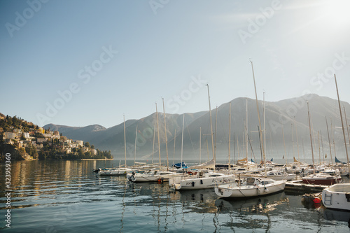 Obraz na płótnie View on Lake Lugano, Monte Bre and Monte Boglia in the background. Lake Lugano is a glacial lake on the border between Switzerland and Italy. View at boats. Sunny day. w salonie