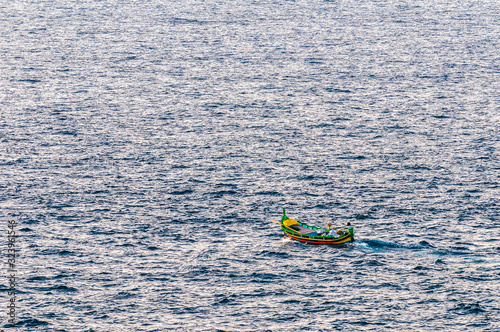 Luzzu boat on Qbajjar Bay, Gozo photo