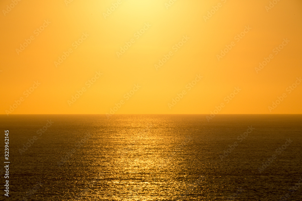 The setting sun shining in the orange sinking in the sea of Japan