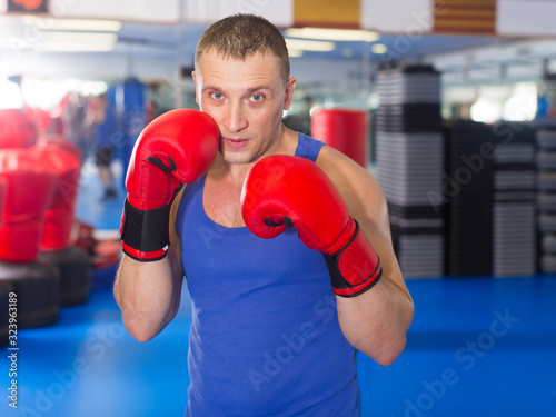 Portrait of young male who is boxing © JackF