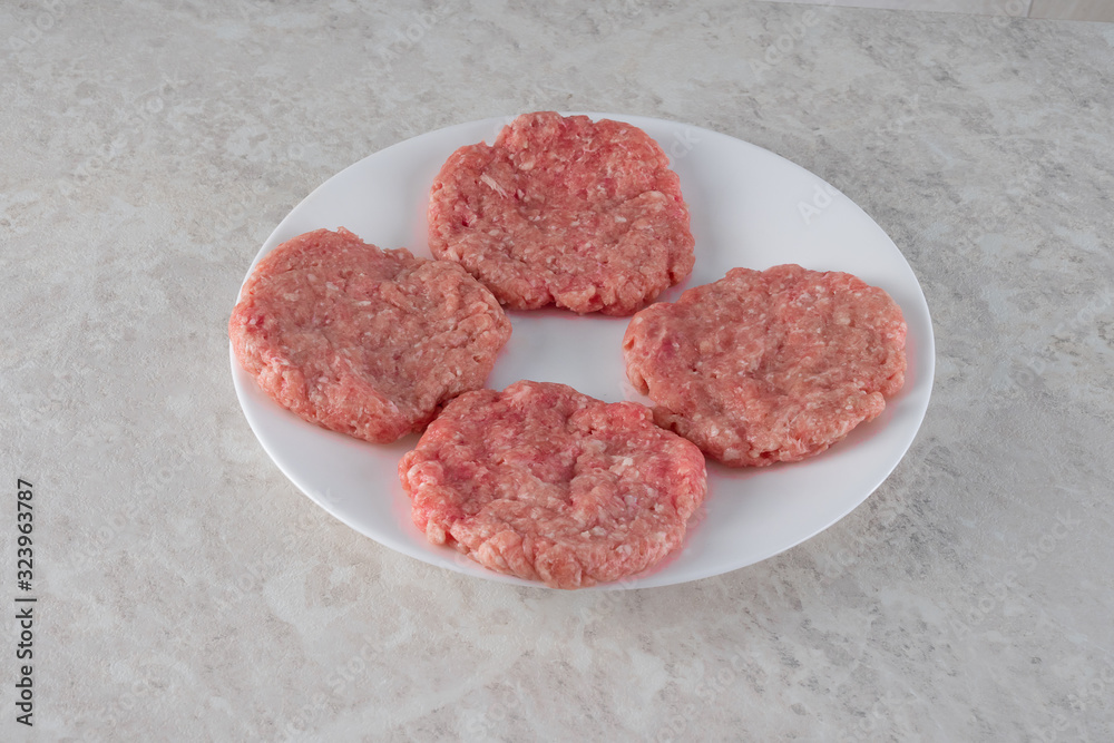 Steaks on a white plate, the concept of proper nutrition. Steaks on a white plate, the concept of proper nutrition.