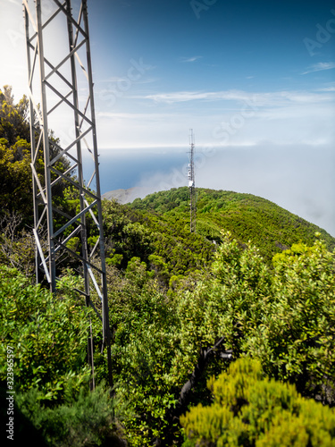 Beautiful image of jungle forest on the mountain and high mobile signal towers