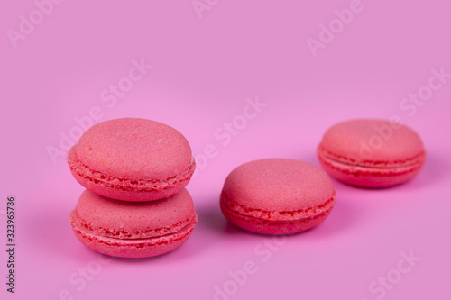 Macaroons on a pink background.