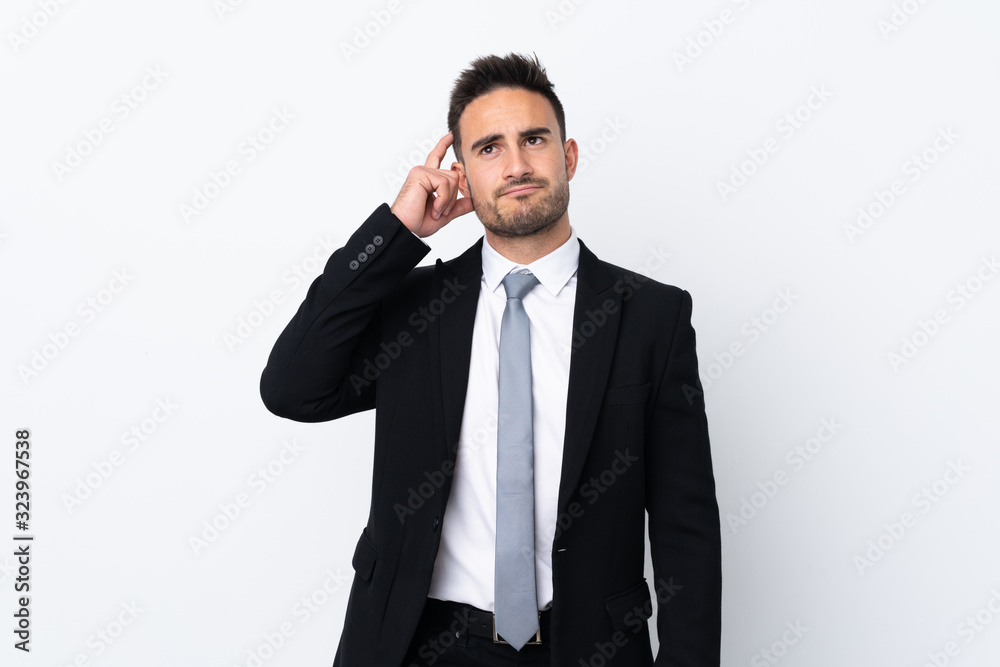 Young business man over isolated background having doubts and with confuse face expression Young business man over isolated background having doubts and with confuse face expression