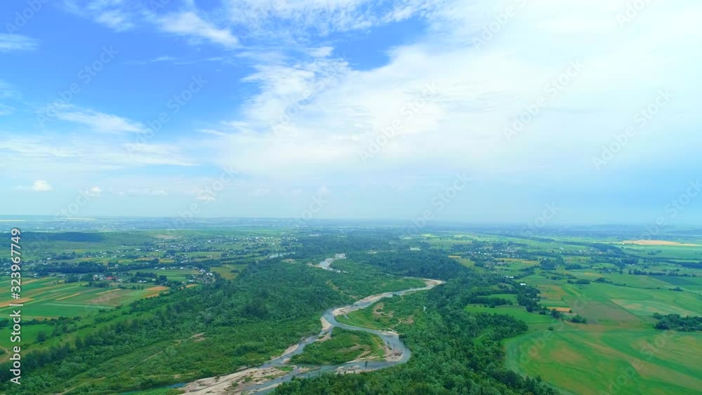 Aerial view of the amazing landscape with big village with river serpentine and lush green meadows. Aerial view of the amazing landscape with big village with river serpentine and lush green meadows.