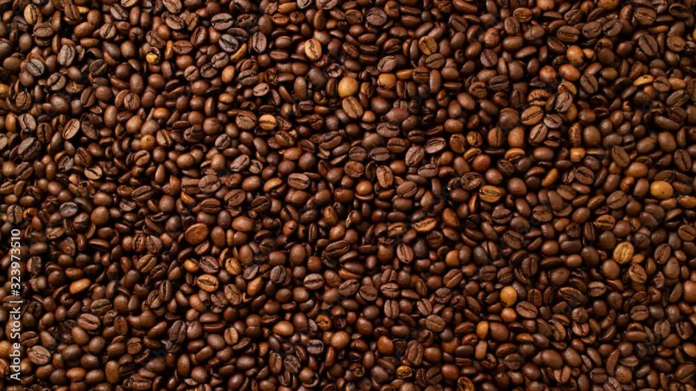 Coffee animated background. Looped video. Stop-motion animation coffee concept. Top view of freshly roasted coffee beans Coffee animated background. Looped video. Stop-motion animation coffee concept. Top view of freshly roasted coffee beans