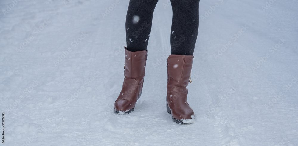 Traveller people with shoes walking on snow in winter season. Traveller people with shoes walking on snow in winter season.