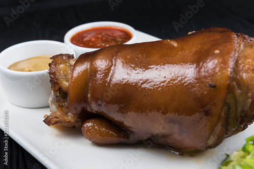 Tasty pork knuckle with sau...