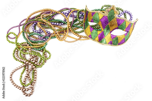 holiday or mardi gras beads and mask making frame isolated on white background