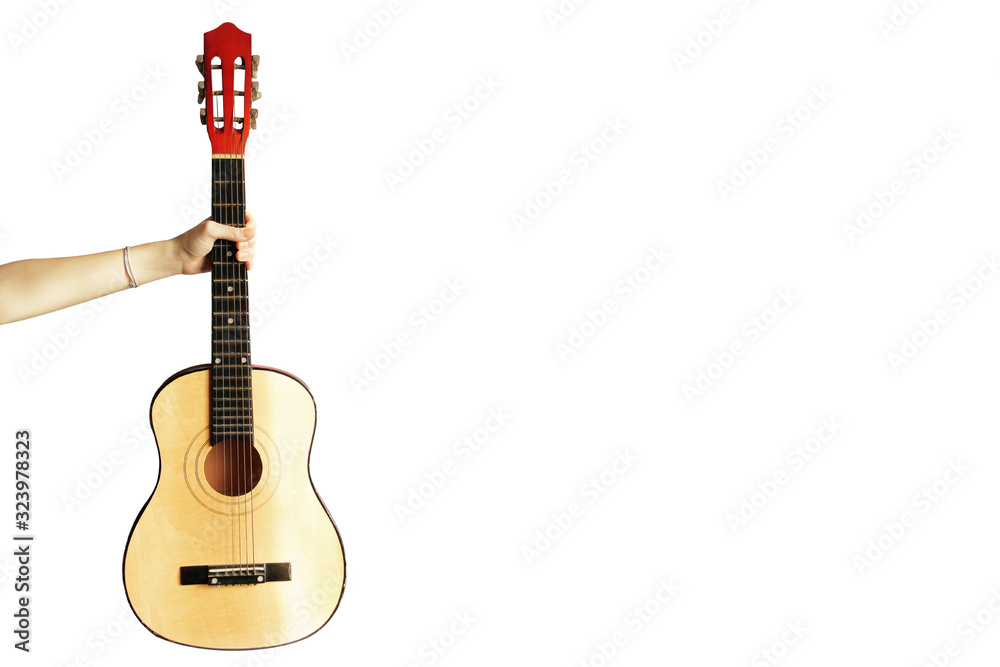 Naklejka premium Guitar in a hand on a white background. Musical instrument
