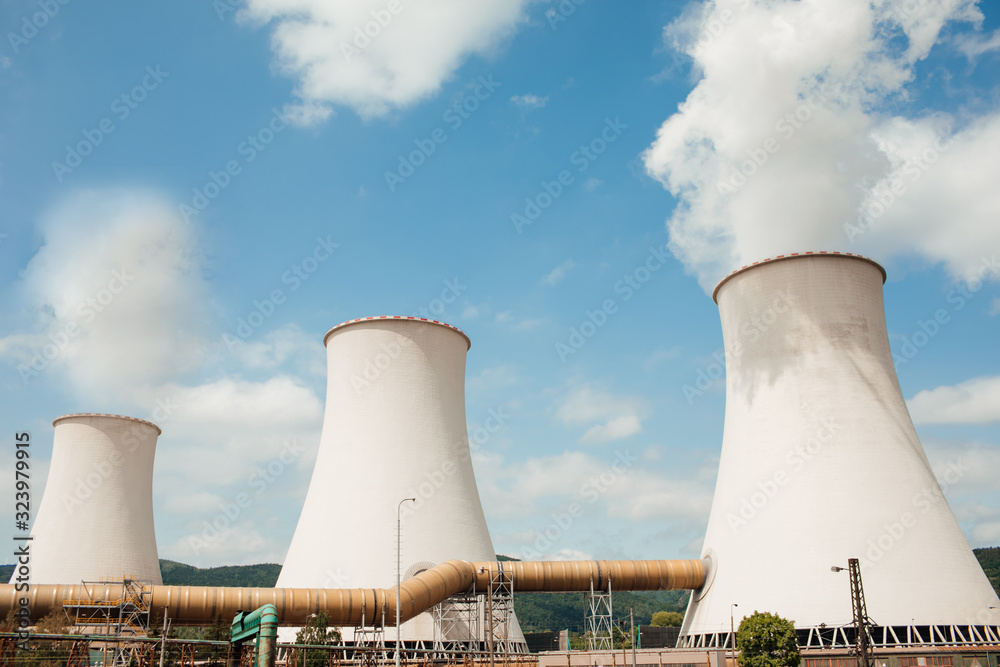 Nuclear power plant. Tops of cooling towers of atomic power plant. Nuclear power station chimneys. Nuclear power plant. Tops of cooling towers of atomic power plant. Nuclear power station chimneys.