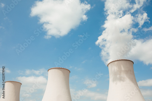 Nuclear power plant. Tops of cooling towers of atomic power plant. Nuclear power station chimneys.