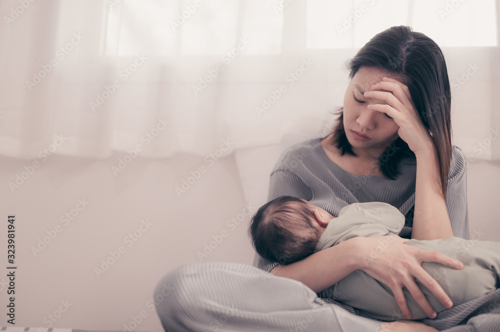 Tired Mother Suffering from experiencing postnatal depression.Health care single mom motherhood stressful.