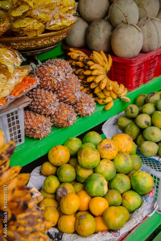 Fresh fruit market with mango, mangosteen and pineapple in Bali
