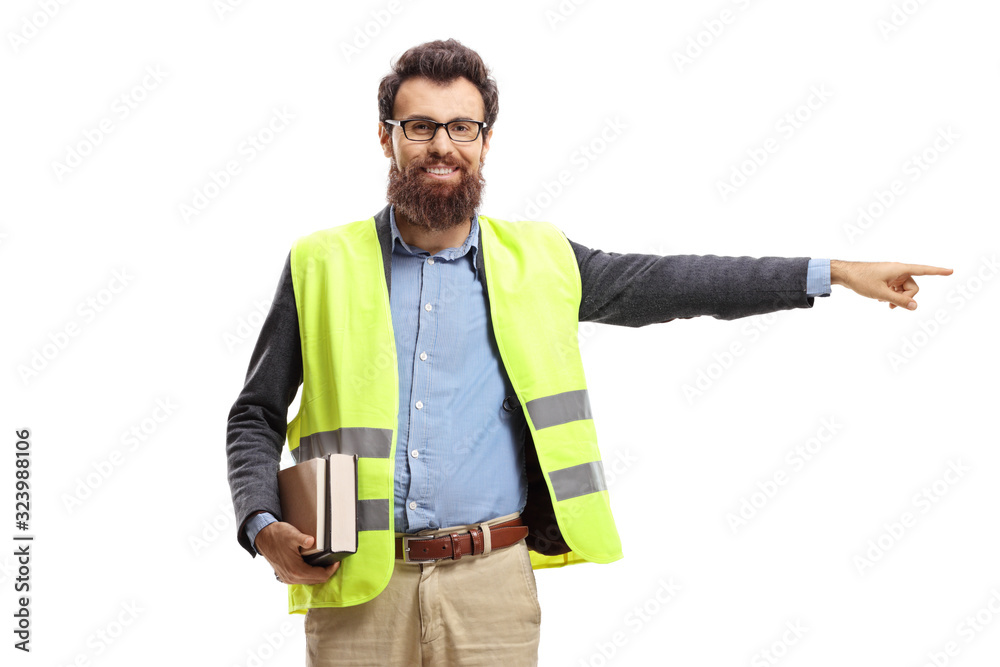 Man holding books, wearing safety vest and pointing Man holding books, wearing safety vest and pointing