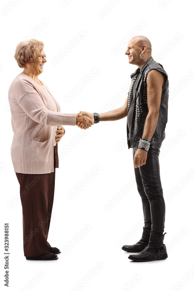 Cheerful elderly woman shaking hand with a bald man Cheerful elderly woman shaking hand with a bald man