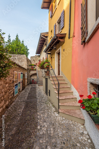 Fototapeta Naklejka Na Ścianę i Meble -  Picturesque small town street view in Malchesine, Lake Garda Italy.