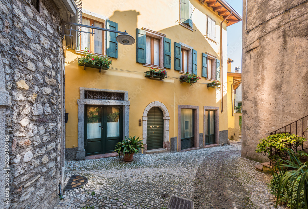 Picturesque small town street view in Malcesine, Lake Garda Italy.