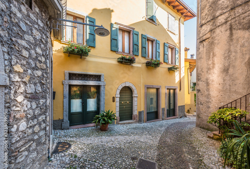 Fototapeta Naklejka Na Ścianę i Meble -  Picturesque small town street view in Malcesine, Lake Garda Italy.