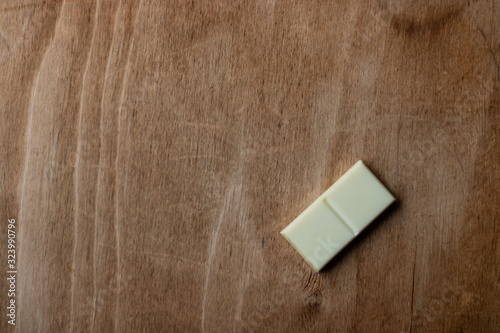 Dotless domino bone on a wooden surface. Dominoes