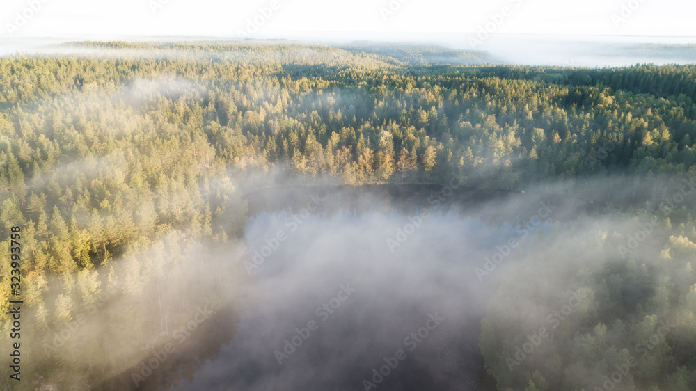 Early misty morning, sunrise over lake. Rural landscape in summer. Aerial view Early misty morning, sunrise over lake. Rural landscape in summer. Aerial view