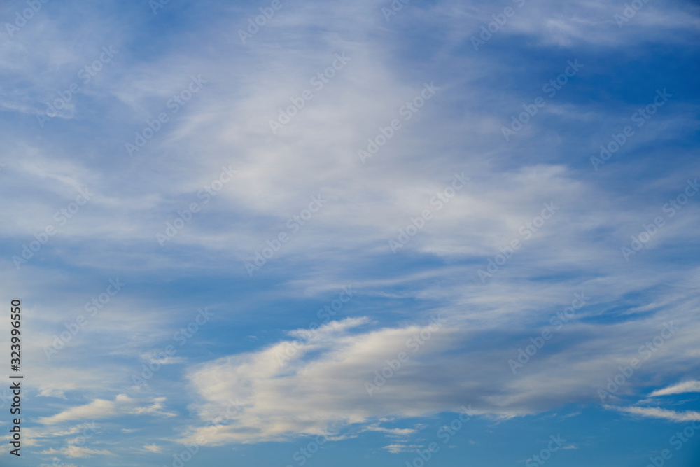 Bright beautiful blue sky with soft clouds for background or texture Bright beautiful blue sky with soft clouds for background or texture