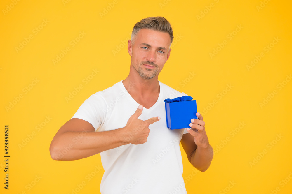 Romantic gift. Mature guy hold present box yellow background. Love romantic feelings concept. Happy birthday darling. Man happy face celebrate valentines day. Little gift. Gift for girlfriend Romantic gift. Mature guy hold present box yellow background. Love romantic feelings concept. Happy birthday darling. Man happy face celebrate valentines day. Little gift. Gift for girlfriend