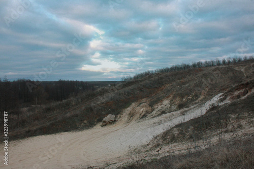 Landscape of a sandy ravine covered with dry grass in winter. Kharkov  Ukraine.