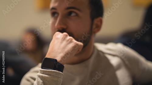 young boy at indoor with a smartwatch
